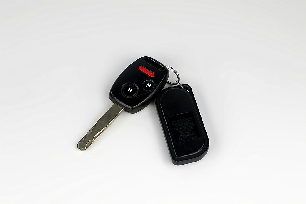 A remote car key with a cut blade and a fob